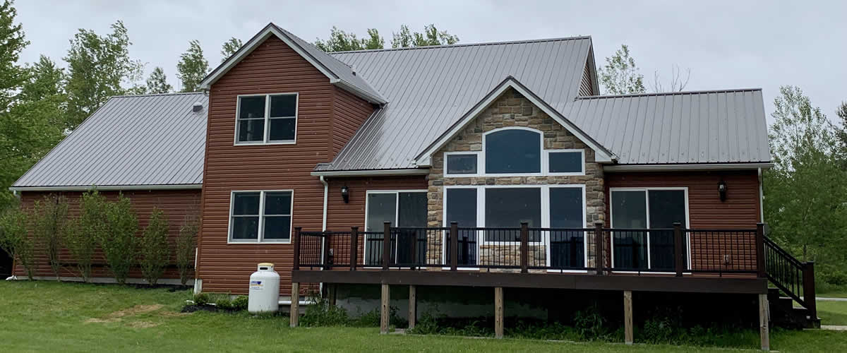New log type home with metal roof