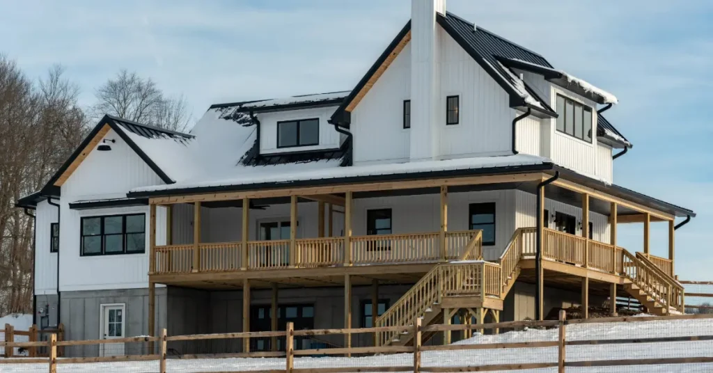 New home built with fresh snowfall around it.