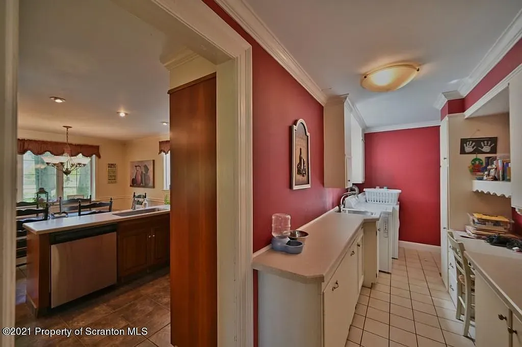 Before of interior kitchen and living space shared wall