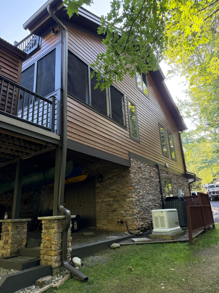 Fiber cement siding installation; exterior rear and side, left side of home
