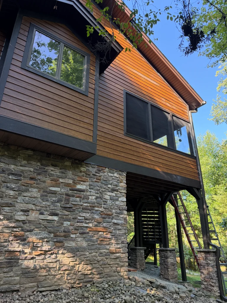 Fiber cement siding with rock foundation