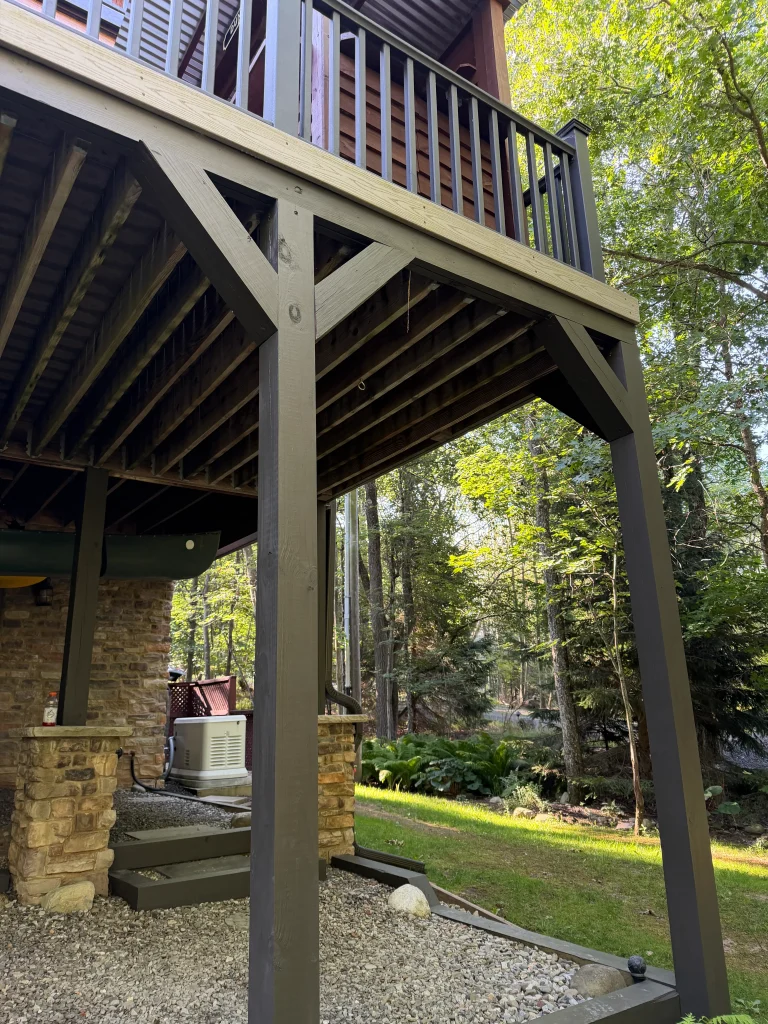 Fiber cement siding installation under deck. exterior rear of home.