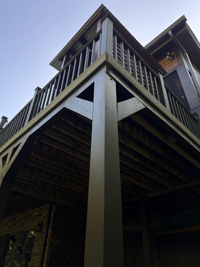 Under deck. Poconos Pines. Exterior fiber cement siding.