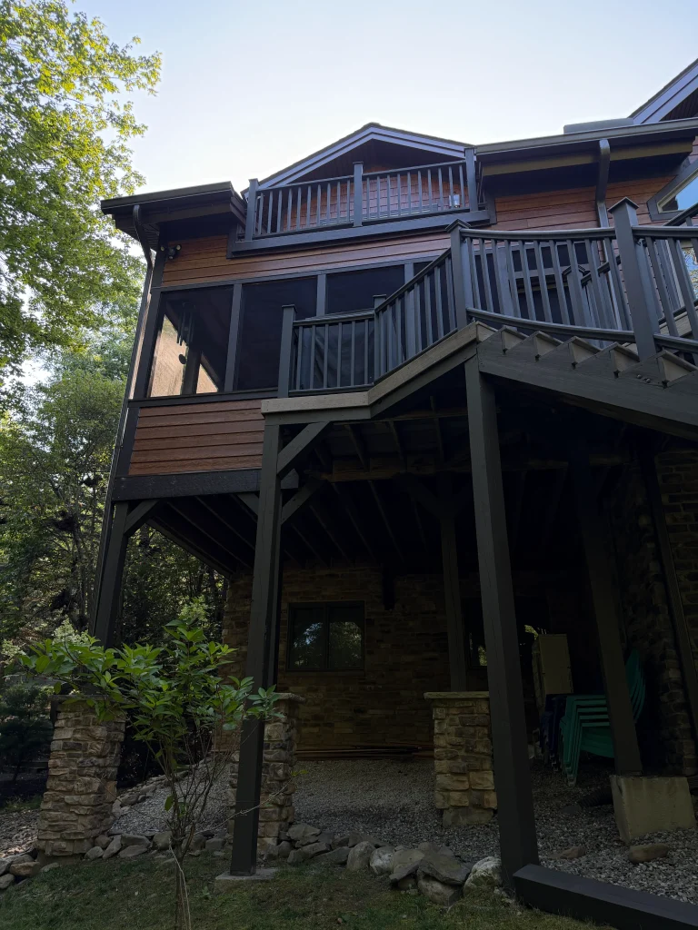 Fiber cement siding installation. Exterior. Rear. Deck with stairs.