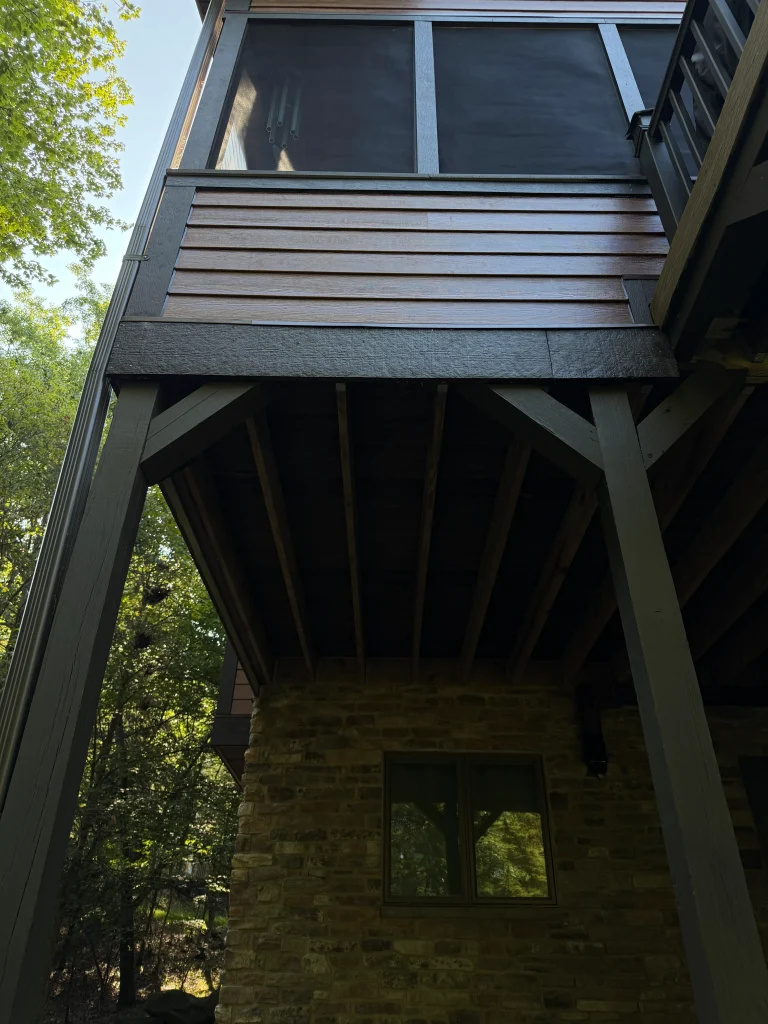 under deck rear of home with new fiber cement siding installation