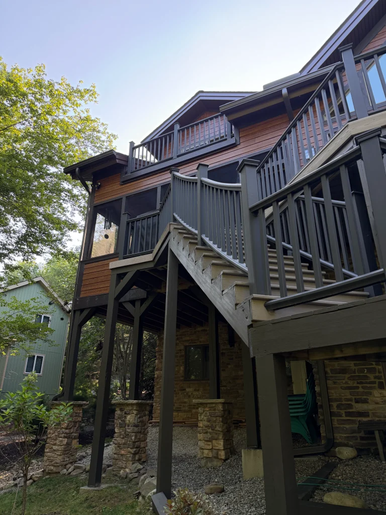 Stairs leading up to Fiber cement siding installation on residential home in Poconos Pines